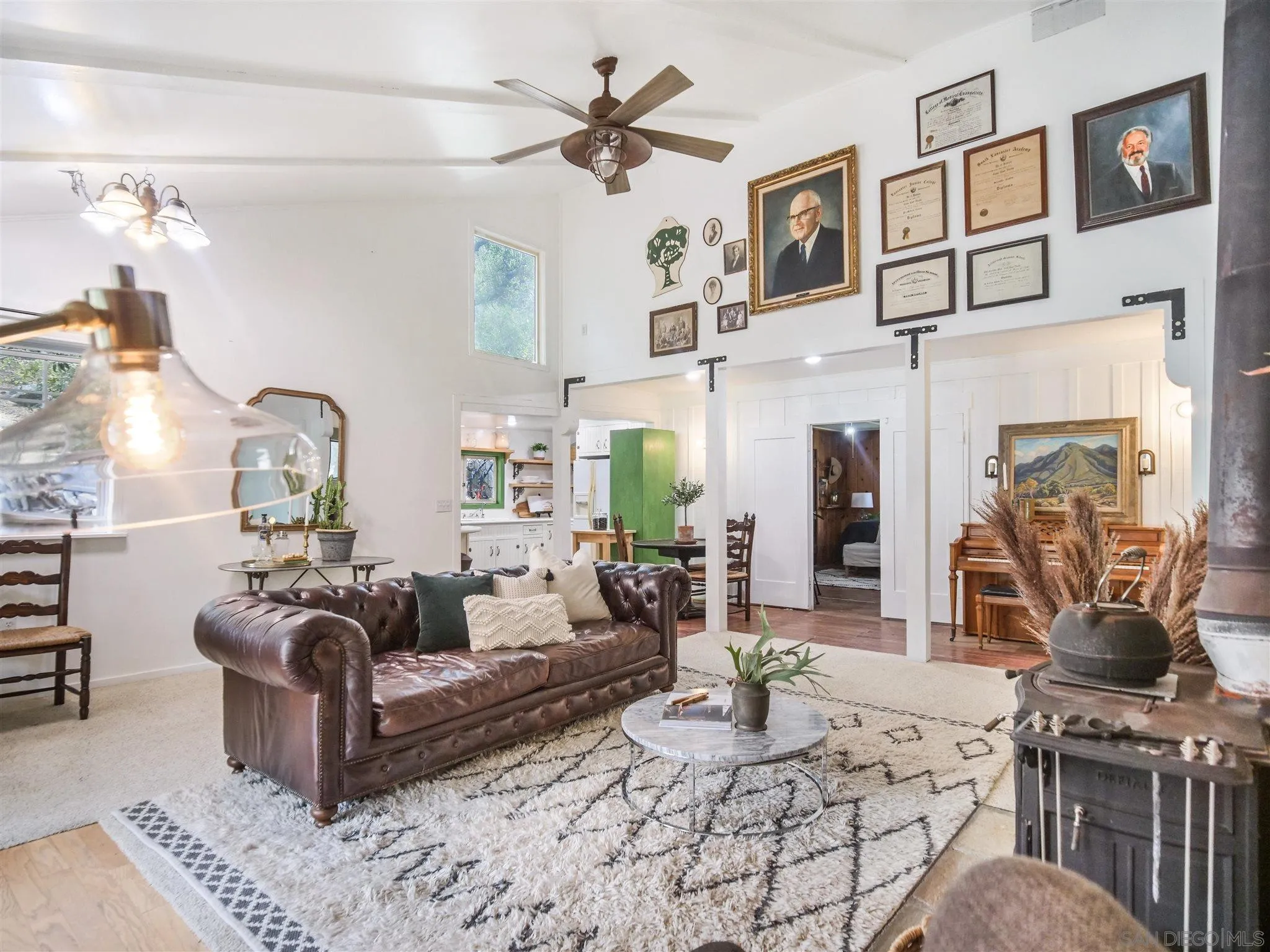 1102 Nicola Ranch Road Fallbrook, CA 92028 - Photo 29 of 63 a living room with furniture a fireplace and decor