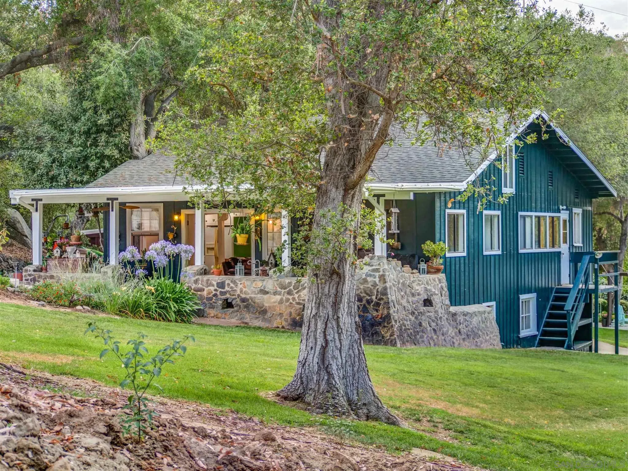 1102 Nicola Ranch Road Fallbrook, CA 92028 - Photo 3 of 63 a front view of a house with a yard