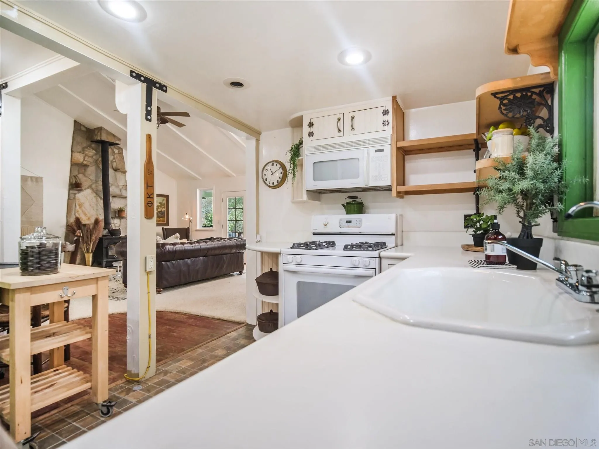 1102 Nicola Ranch Road Fallbrook, CA 92028 - Photo 31 of 63 a kitchen with stainless steel appliances a stove a sink and a cabinets