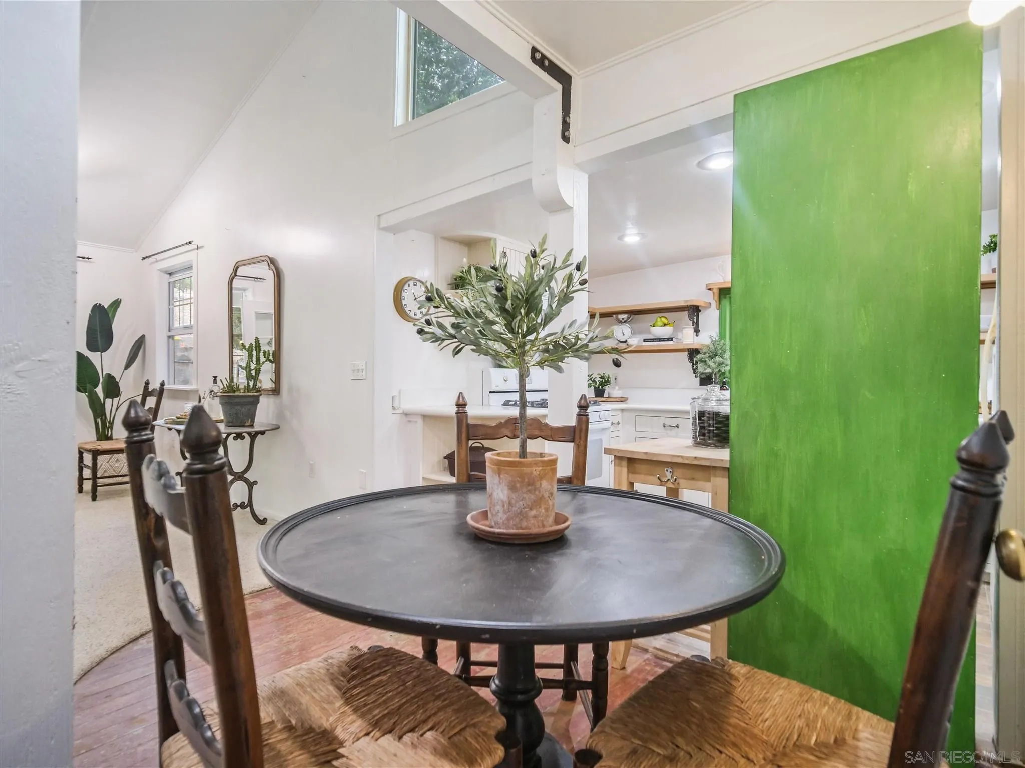 1102 Nicola Ranch Road Fallbrook, CA 92028 - Photo 32 of 63 a view of a dining room with furniture and a potted plant