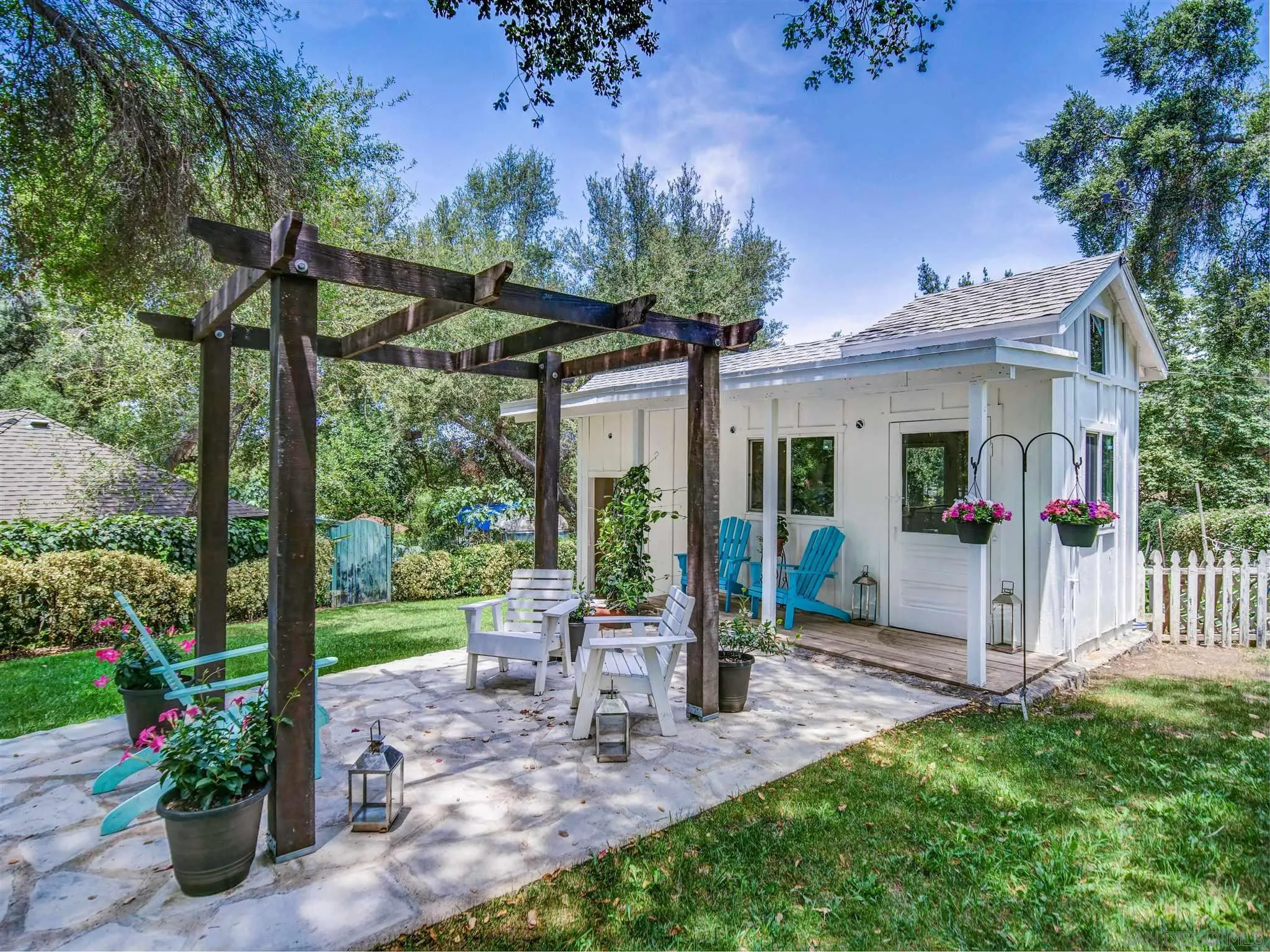 1102 Nicola Ranch Road Fallbrook, CA 92028 - Photo 44 of 63 a view of a house with backyard and a garden