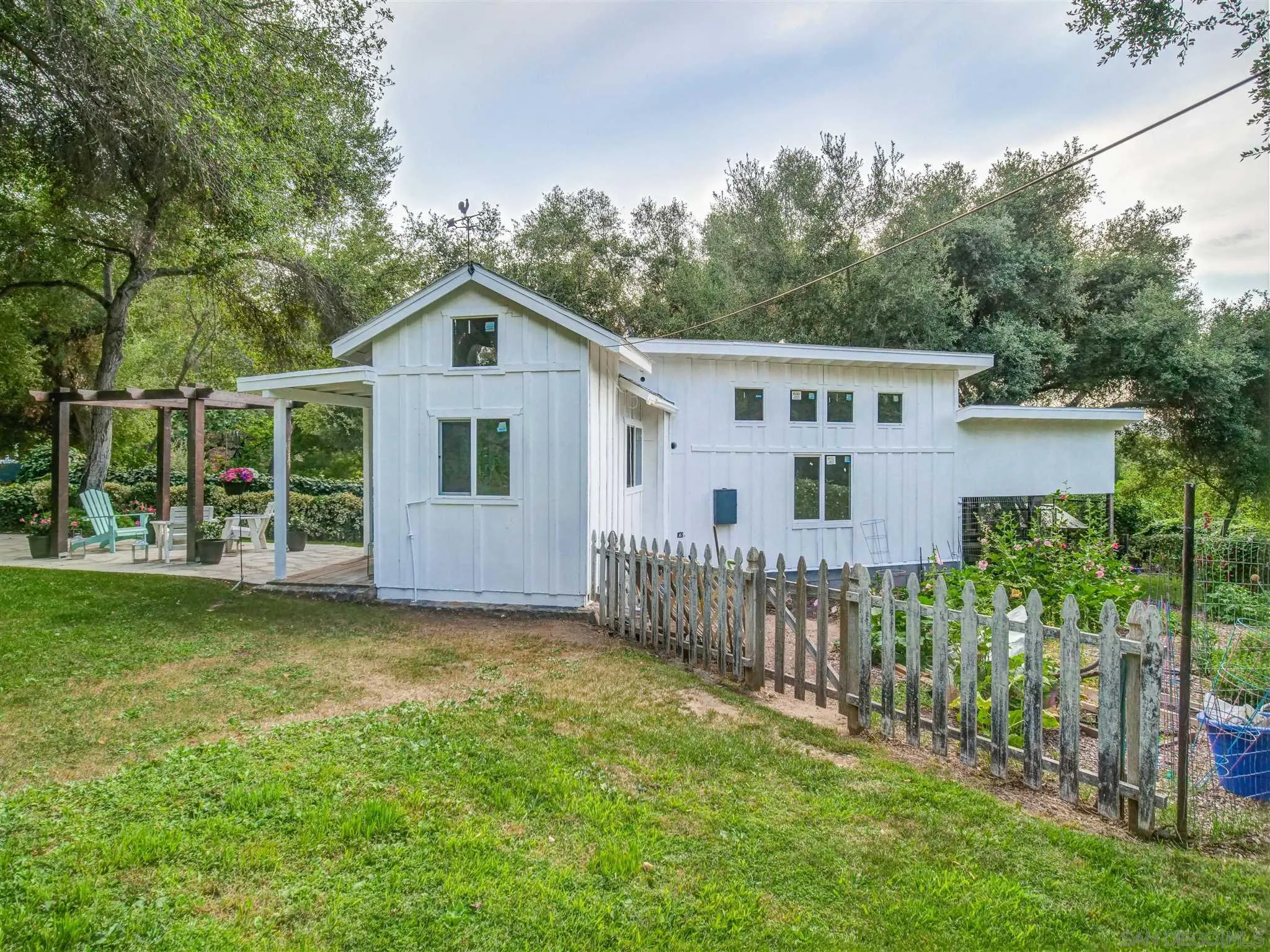 1102 Nicola Ranch Road Fallbrook, CA 92028 - Photo 46 of 63 a view of a house with a yard and garden