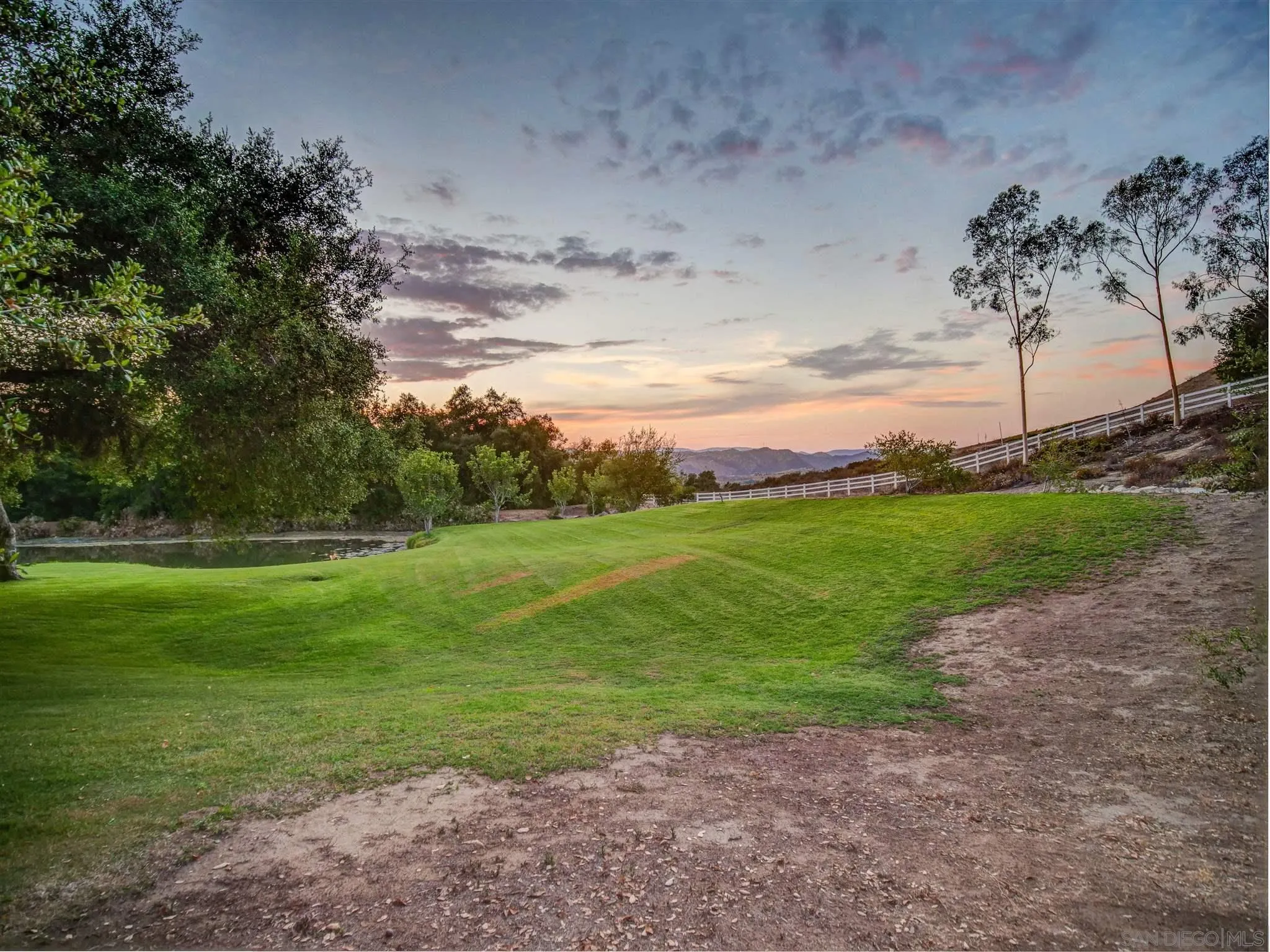 1102 Nicola Ranch Road Fallbrook, CA 92028 - Photo 56 of 63 a view of a golf course with a lake