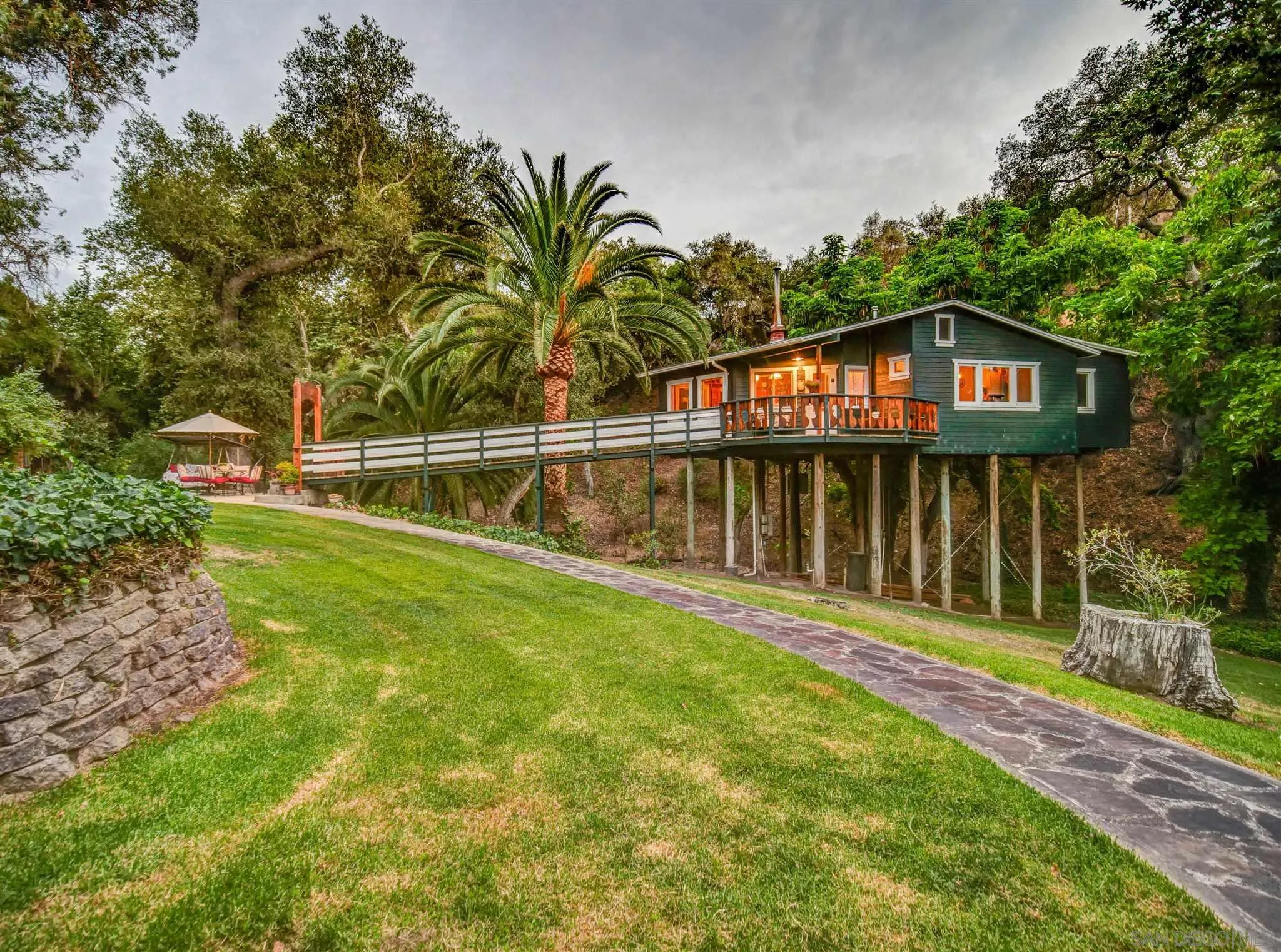 1102 Nicola Ranch Road Fallbrook, CA 92028 - Photo 9 of 63 a view of a house with a yard and deck