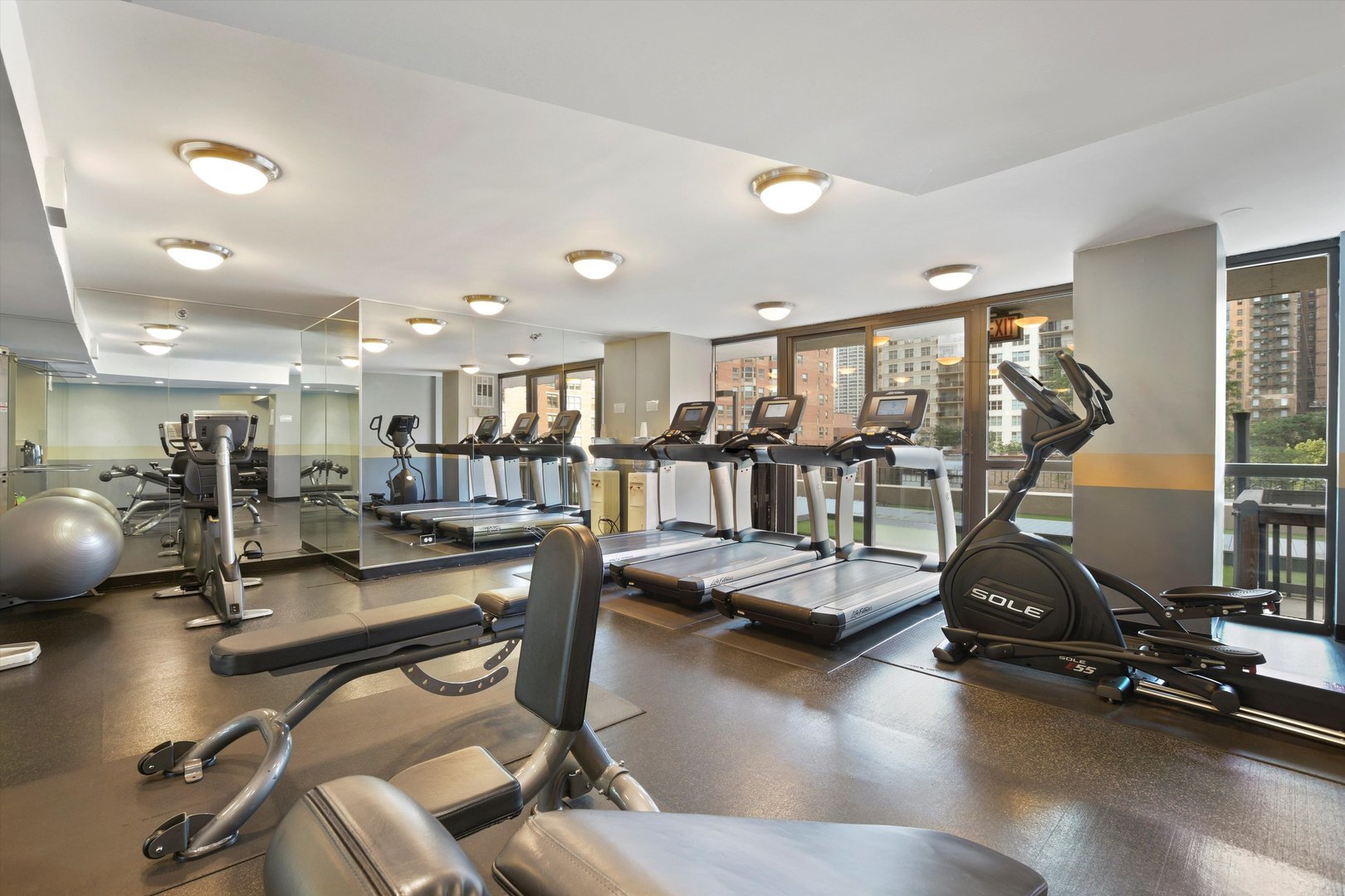 33 West Delaware Place, Unit 10G Chicago, IL 60610 - Photo 15 of 20 a view of a room with gym equipment