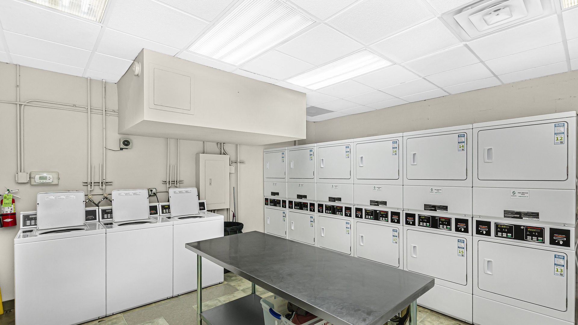33 West Delaware Place, Unit 10G Chicago, IL 60610 - Photo 17 of 20 a kitchen with white cabinets and white appliances