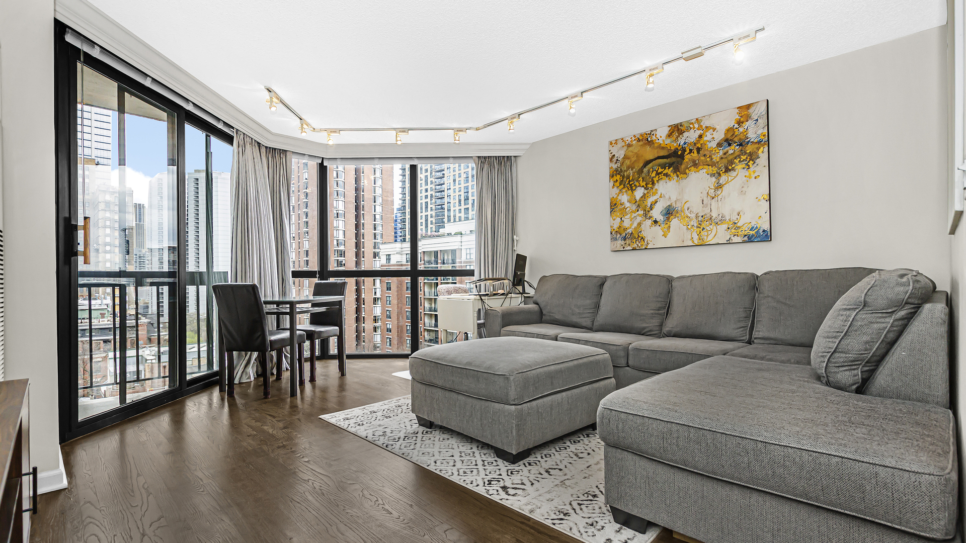 33 West Delaware Place, Unit 10G Chicago, IL 60610 - Photo 3 of 20 a living room with furniture and a large window