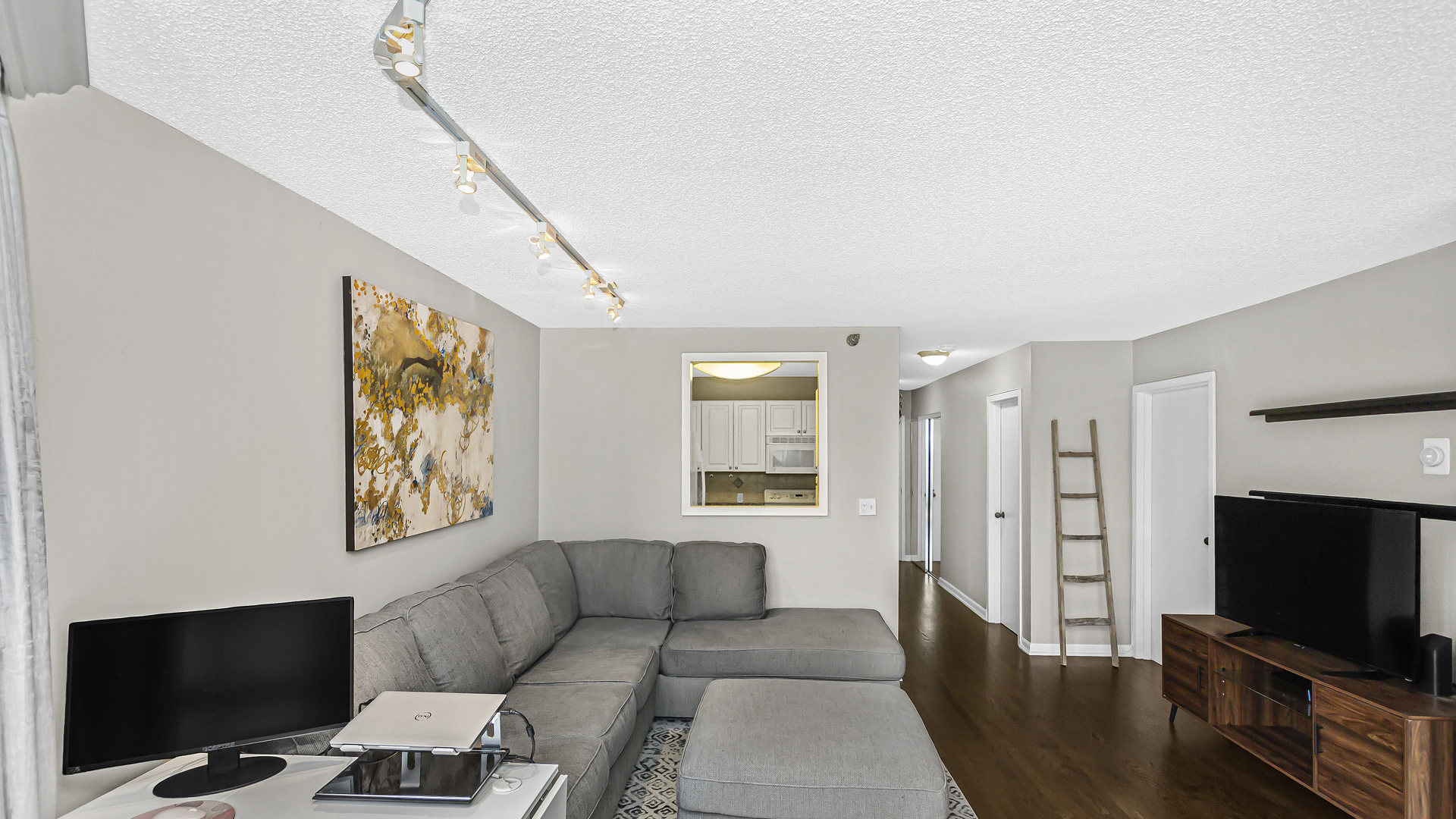 33 West Delaware Place, Unit 10G Chicago, IL 60610 - Photo 4 of 20 a living room with furniture and a flat screen tv