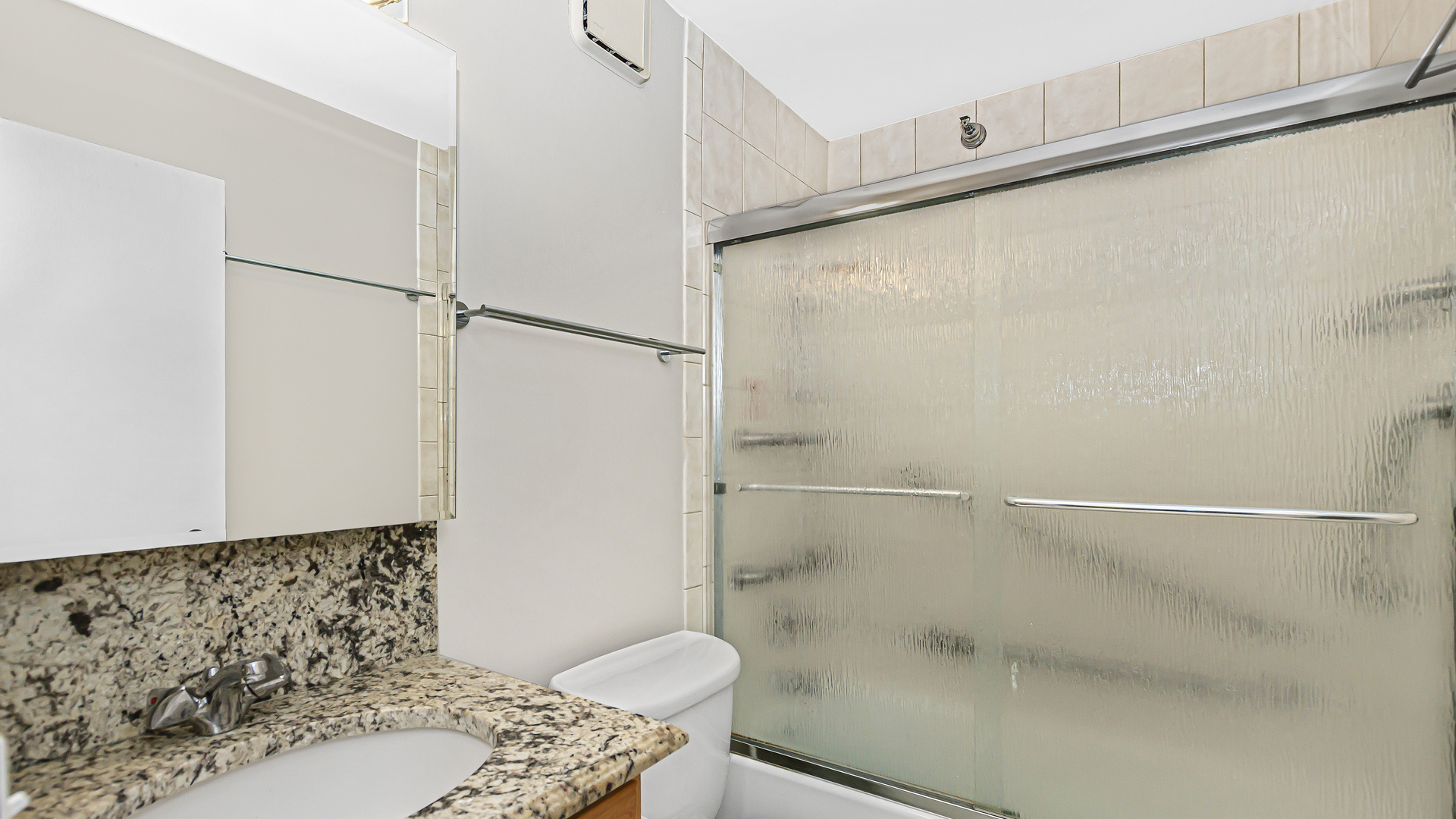 33 West Delaware Place, Unit 10G Chicago, IL 60610 - Photo 10 of 20 a bathroom with a sink and a shower