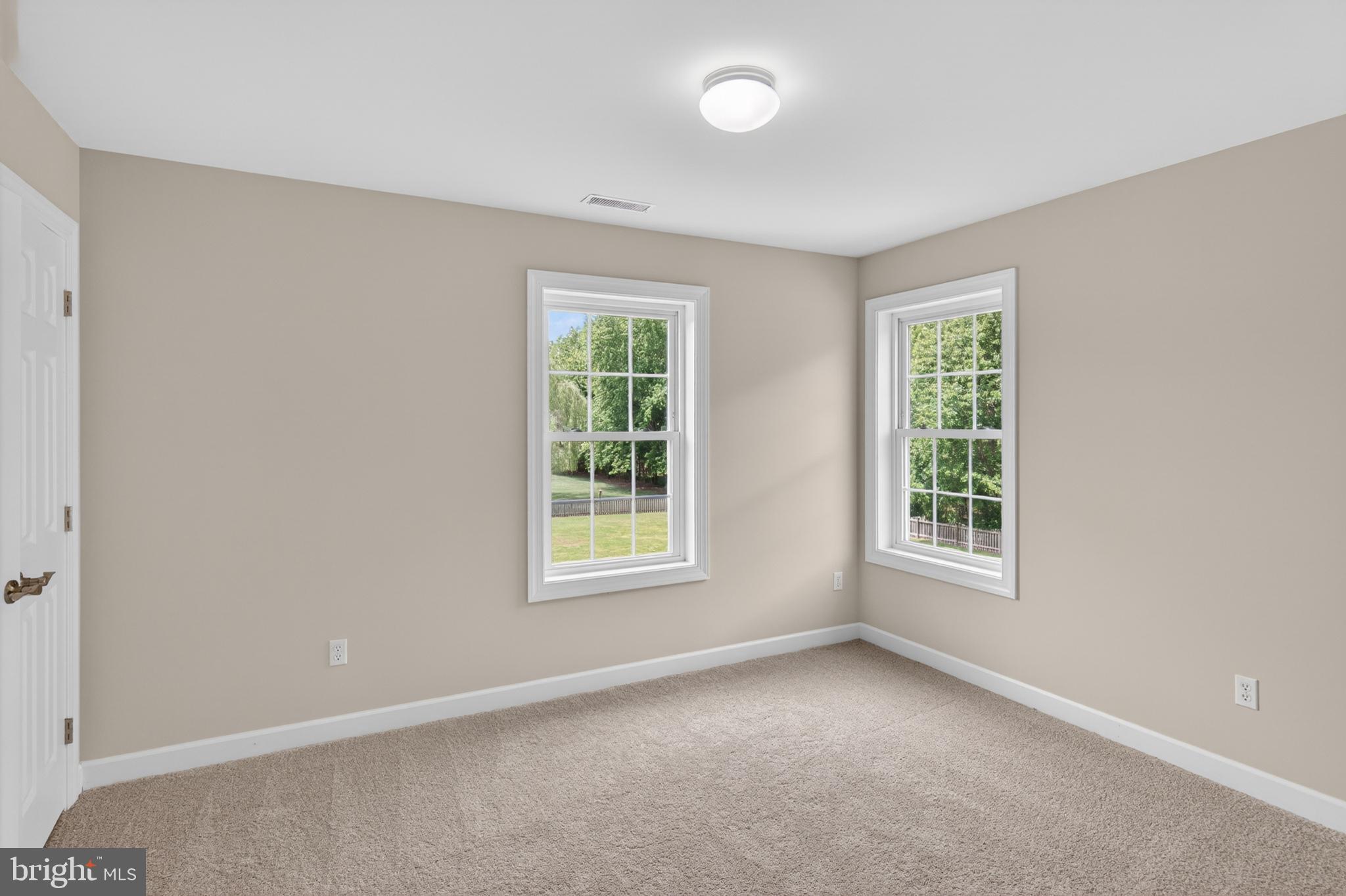 337 Roe Ingleside Road Centreville, MD 21617 - Photo 35 of 56 an empty room with windows