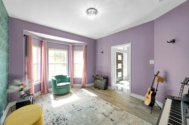 a bedroom with furniture and a window