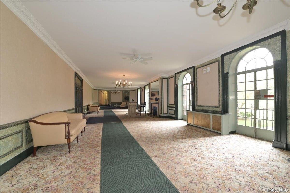 175-06 Devonshire Road, Unit 4M Queens, NY 11432 - Photo 18 of 18 a view of a livingroom with furniture and a window