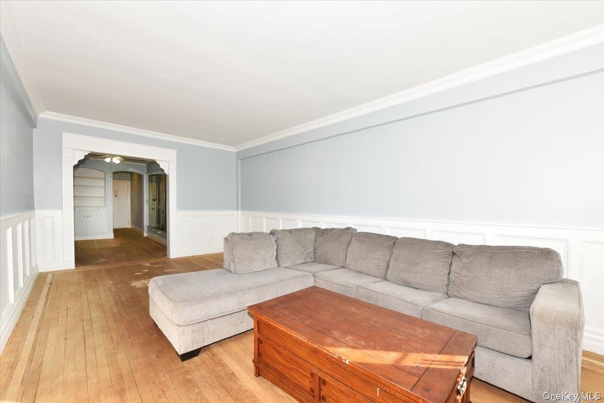 175-06 Devonshire Road, Unit 4M Queens, NY 11432 - Photo 5 of 18 a living room with furniture and a couch