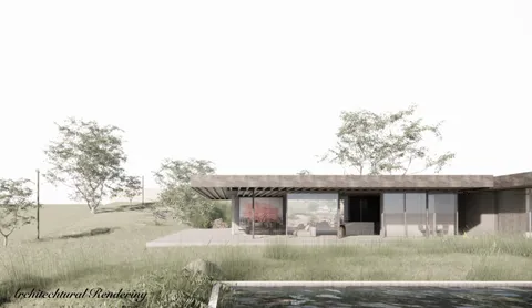 a backyard of a house with table and chairs