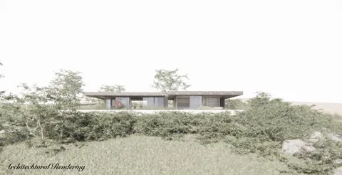 a front view of a house with yard and seating space