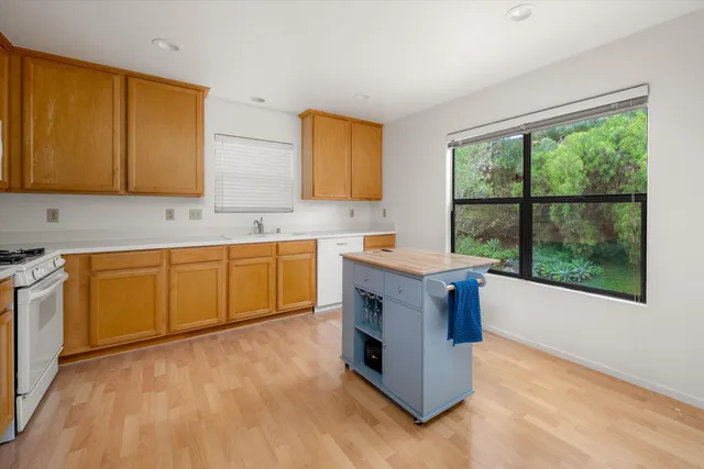 a view of front of a house with a garden