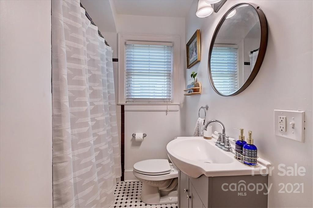 3404 Ritch Avenue Charlotte, NC 28206 - Photo 12 of 33 a bathroom with a toilet and a sink