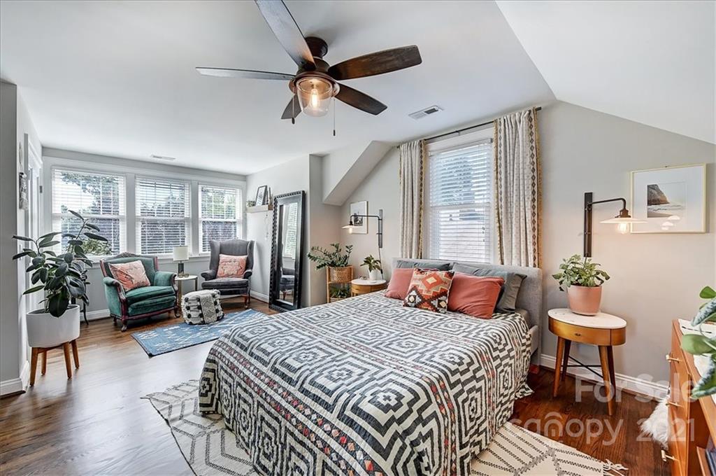 3404 Ritch Avenue Charlotte, NC 28206 - Photo 14 of 33 a bedroom with a bed and wooden floor