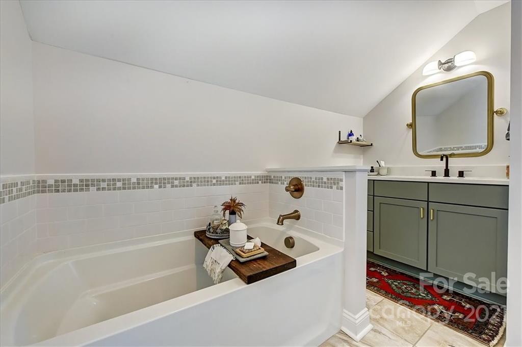 3404 Ritch Avenue Charlotte, NC 28206 - Photo 17 of 33 a bathroom with a sink mirror and vanity