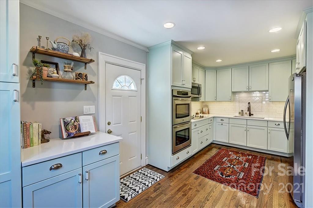 3404 Ritch Avenue Charlotte, NC 28206 - Photo 4 of 33 a kitchen with a refrigerator and cabinets