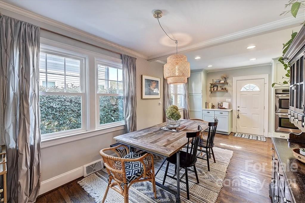 3404 Ritch Avenue Charlotte, NC 28206 - Photo 9 of 33 a view of a dining room with furniture window and wooden floor