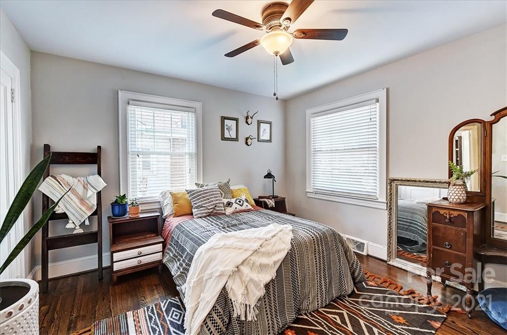 3404 Ritch Avenue Charlotte, NC 28206 - Photo 10 of 33 a bedroom with a bed and wooden floor
