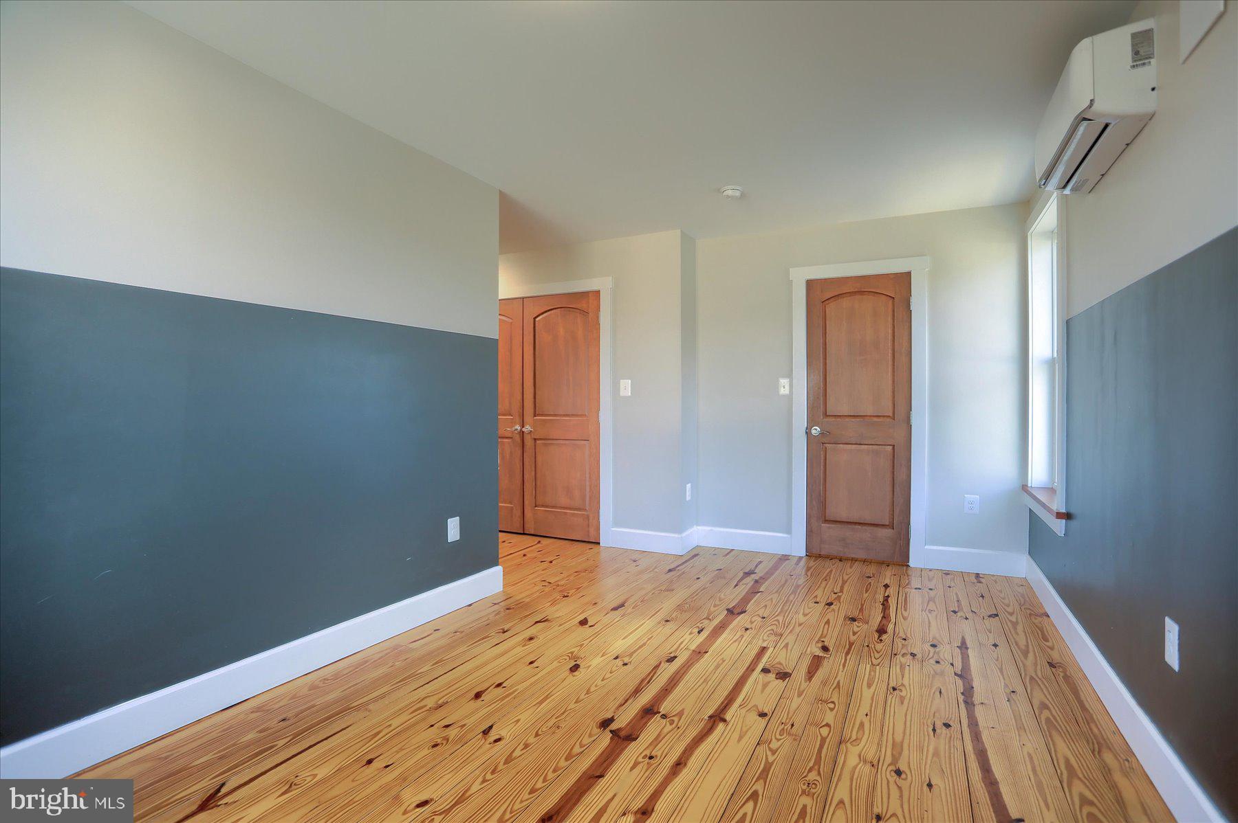 2507 Island View Road Essex, MD 21221 - Photo 20 of 51 a view of a room with wooden floor and bathroom