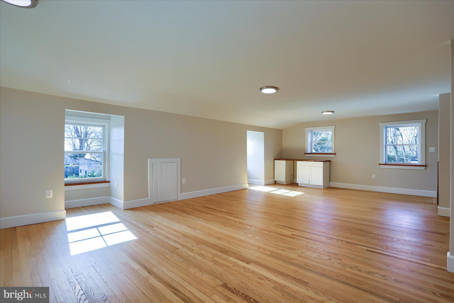 2507 Island View Road Essex, MD 21221 - Photo 29 of 51 a view of an empty room with window and wooden floor