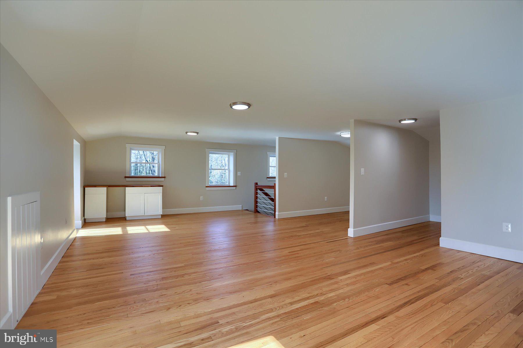 2507 Island View Road Essex, MD 21221 - Photo 30 of 51 a view of an empty room with wooden floor and a window