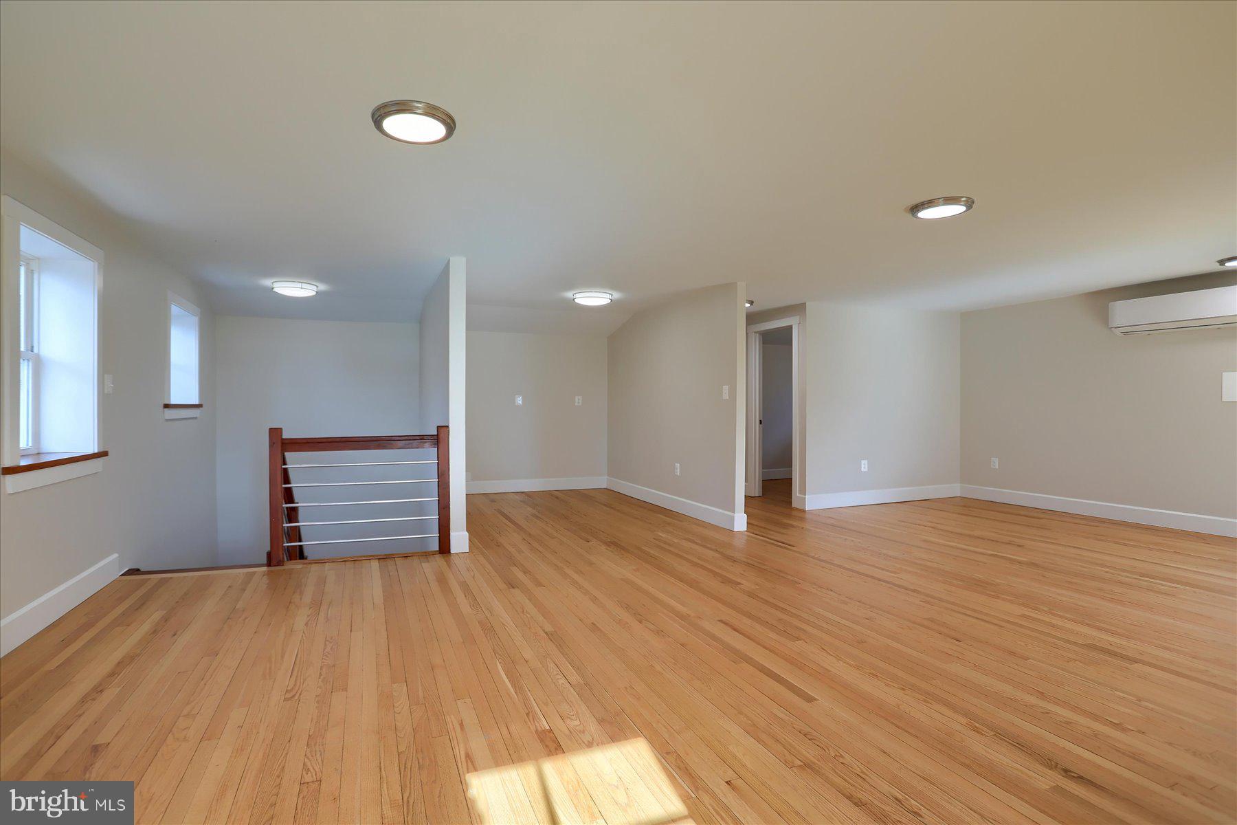 2507 Island View Road Essex, MD 21221 - Photo 32 of 51 a view of empty room with wooden floor and fan