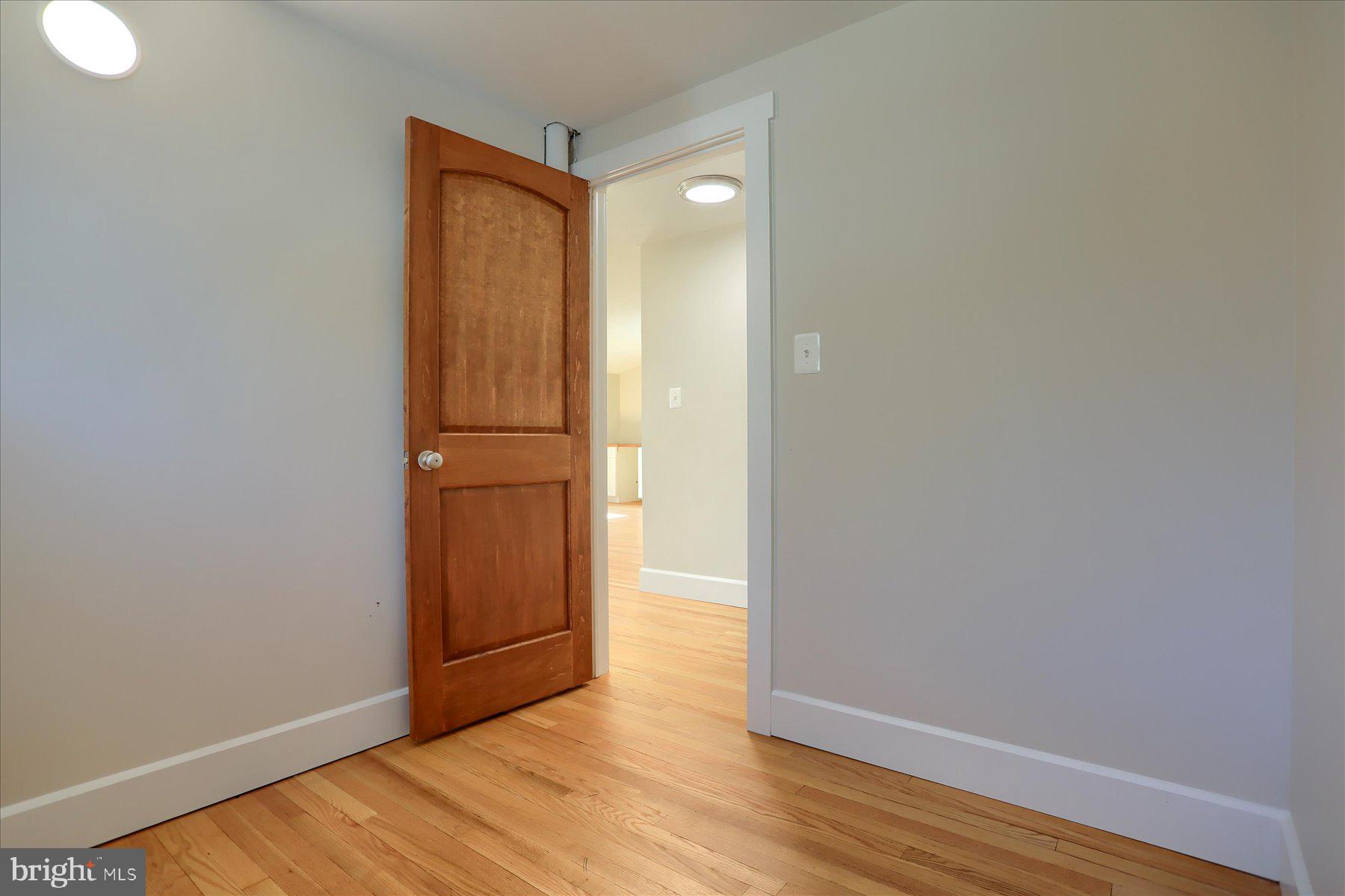 2507 Island View Road Essex, MD 21221 - Photo 34 of 51 a view of empty room with wooden floor