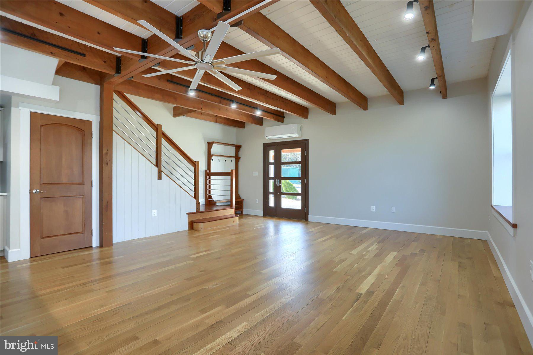 2507 Island View Road Essex, MD 21221 - Photo 6 of 51 a view of an empty room with wooden floor and a window