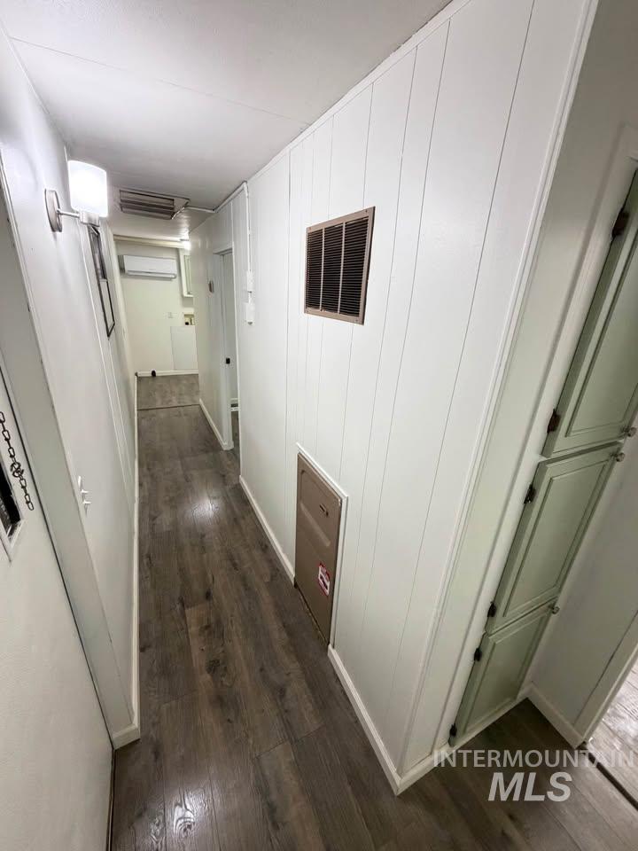 15881 Purple Sage Road, Unit 48 Caldwell, ID 83607 - Photo 16 of 17 Hallway featuring dark wood-style flooring and cooling unit
