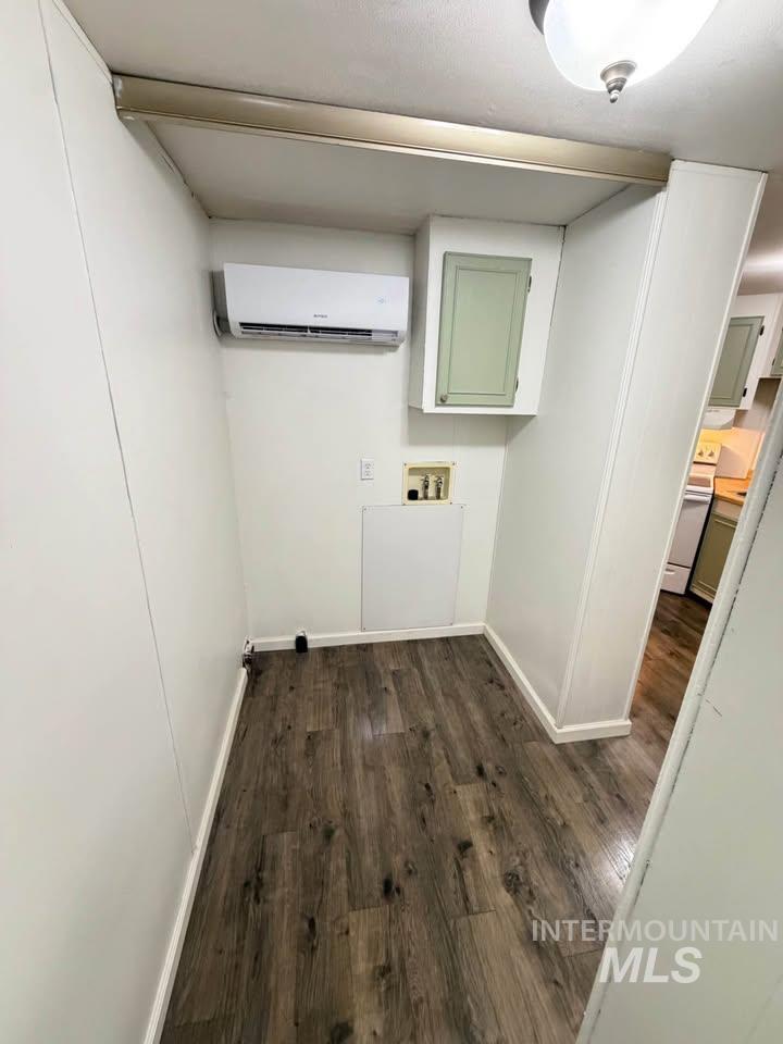 15881 Purple Sage Road, Unit 48 Caldwell, ID 83607 - Photo 17 of 17 Laundry room with dark wood-style flooring and washer hookup