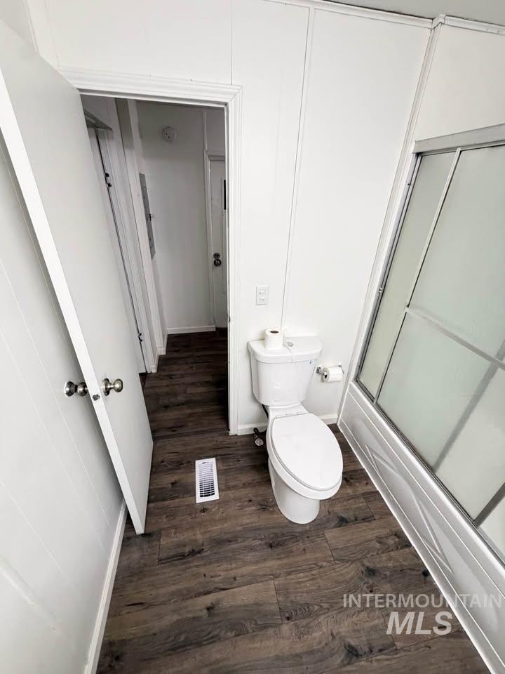 15881 Purple Sage Road, Unit 48 Caldwell, ID 83607 - Photo 7 of 17 Bathroom featuring dark wood finished floors and enclosed tub / shower combo