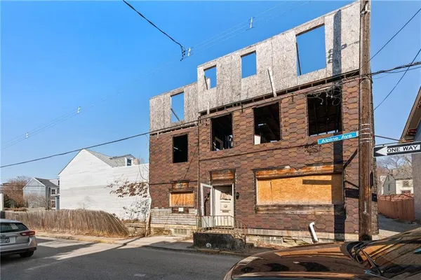 a view of a street with cars