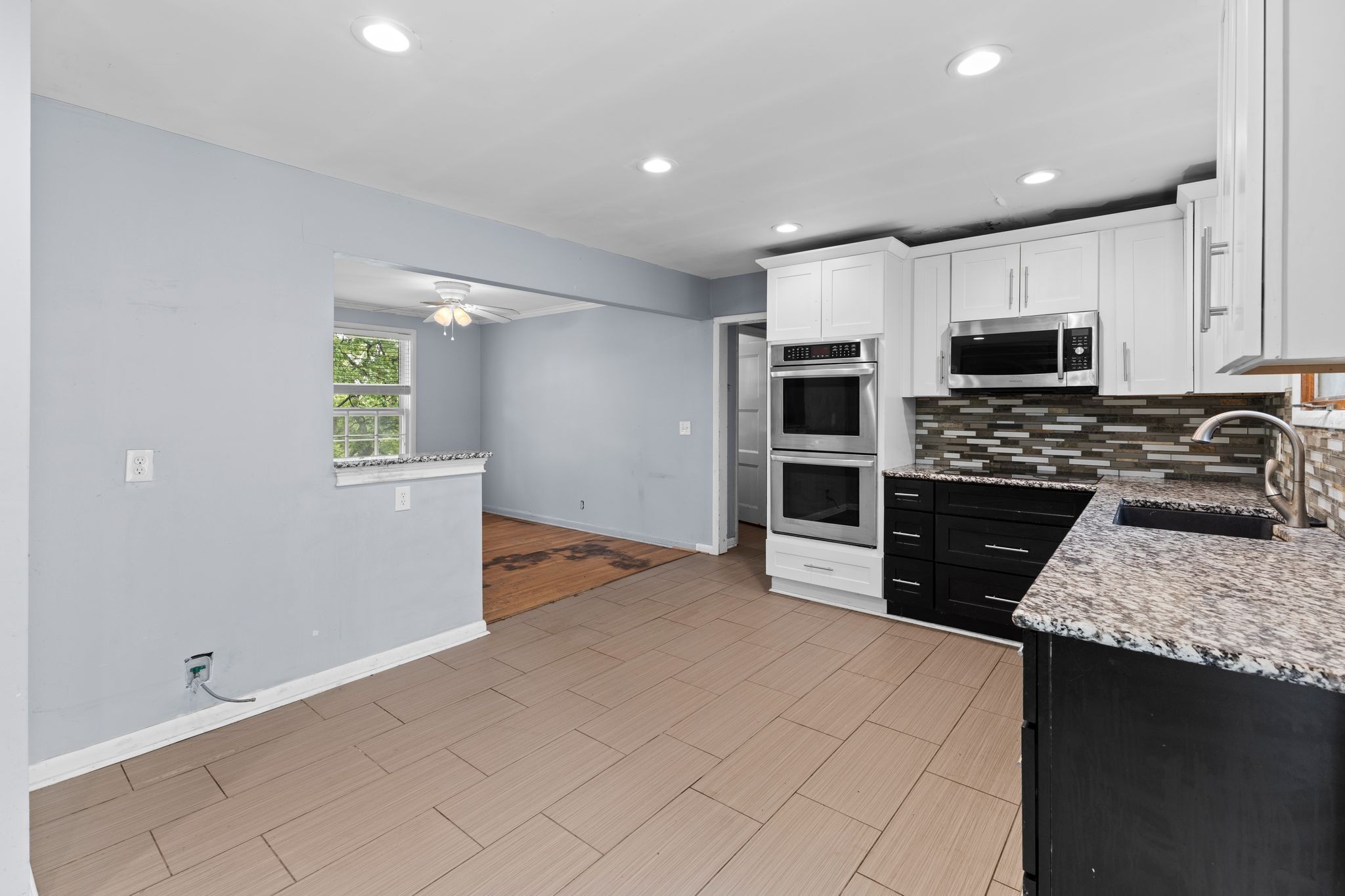483 Franklin Road Franklin, TN 37069 - Photo 13 of 48 a kitchen with stainless steel appliances granite countertop a stove a sink and a refrigerator