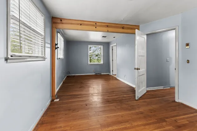 a view of a house with backyard sitting area and garden