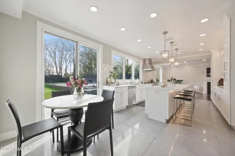 a view of a dining room with furniture window and outside view
