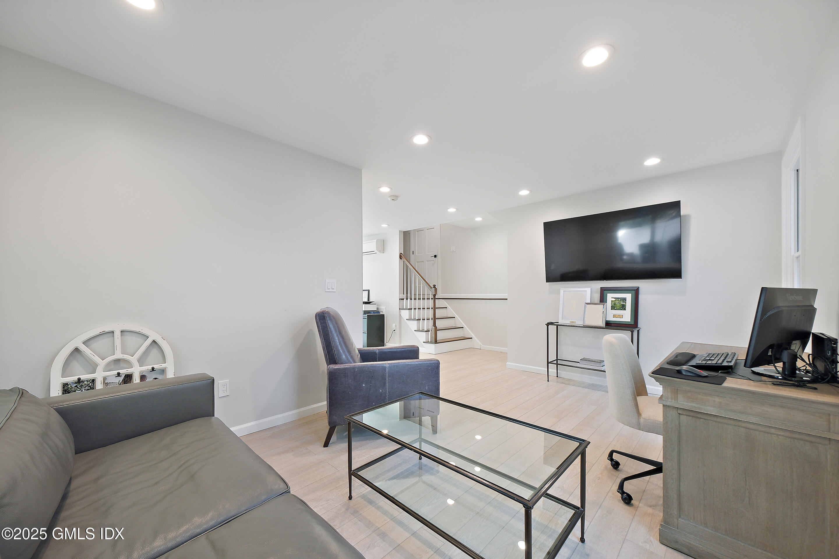 4 Banksville Avenue Greenwich, CT 06831 - Photo 15 of 37 a living room with furniture and a flat screen tv