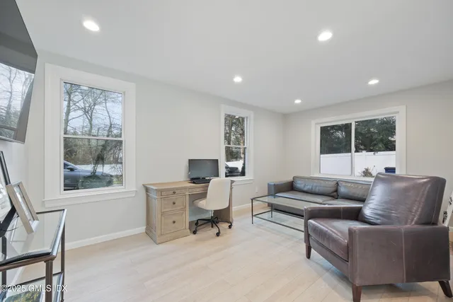 a living room with furniture and a window
