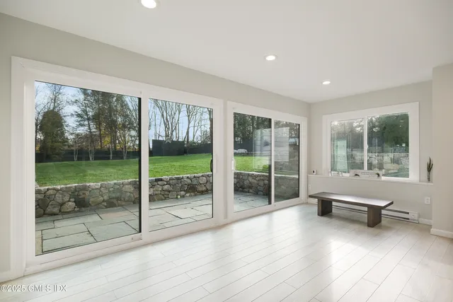 a living room with couch and windows
