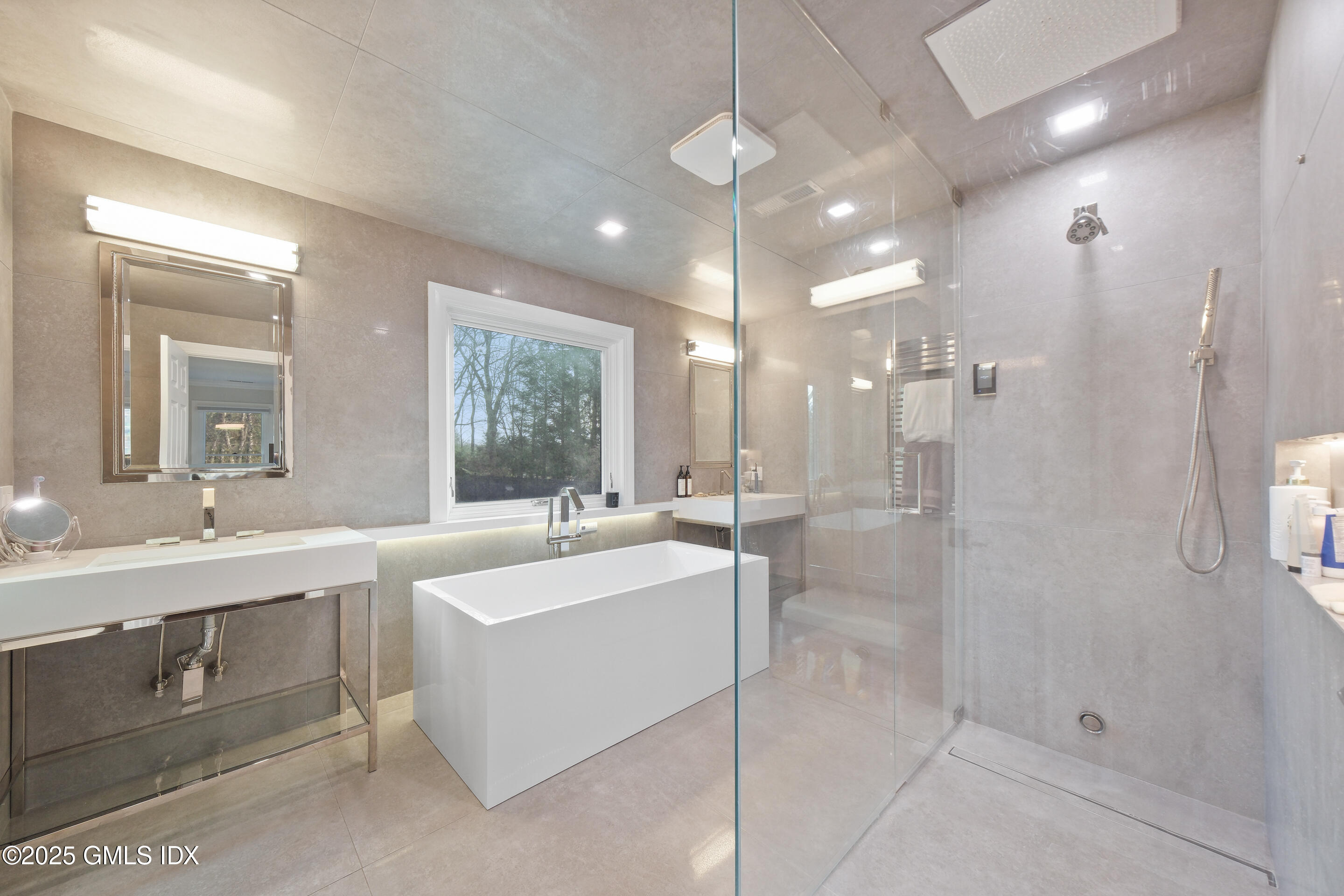 4 Banksville Avenue Greenwich, CT 06831 - Photo 22 of 37 a large bathroom with a sink a large mirror and shower