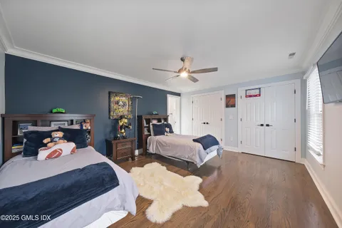 a bed room with two bed and a chandelier