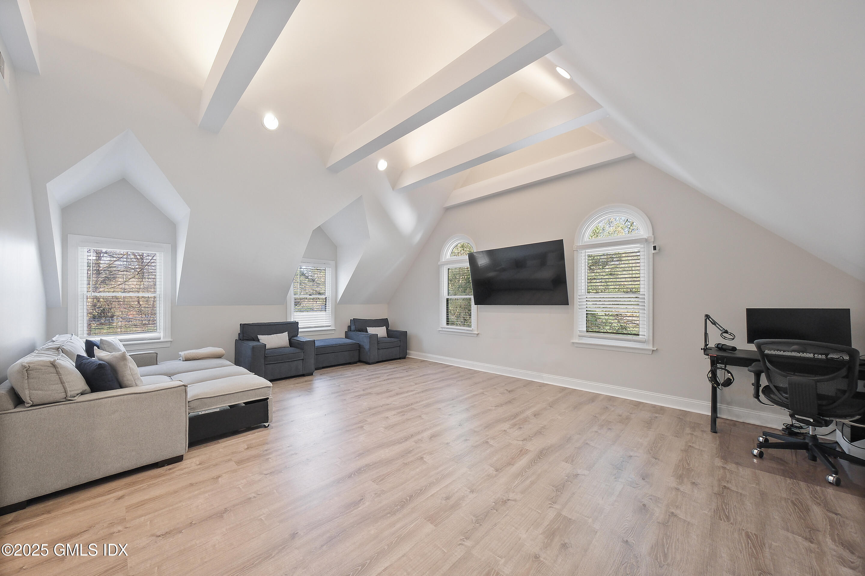 4 Banksville Avenue Greenwich, CT 06831 - Photo 28 of 37 a living room with furniture a flat screen tv and a window