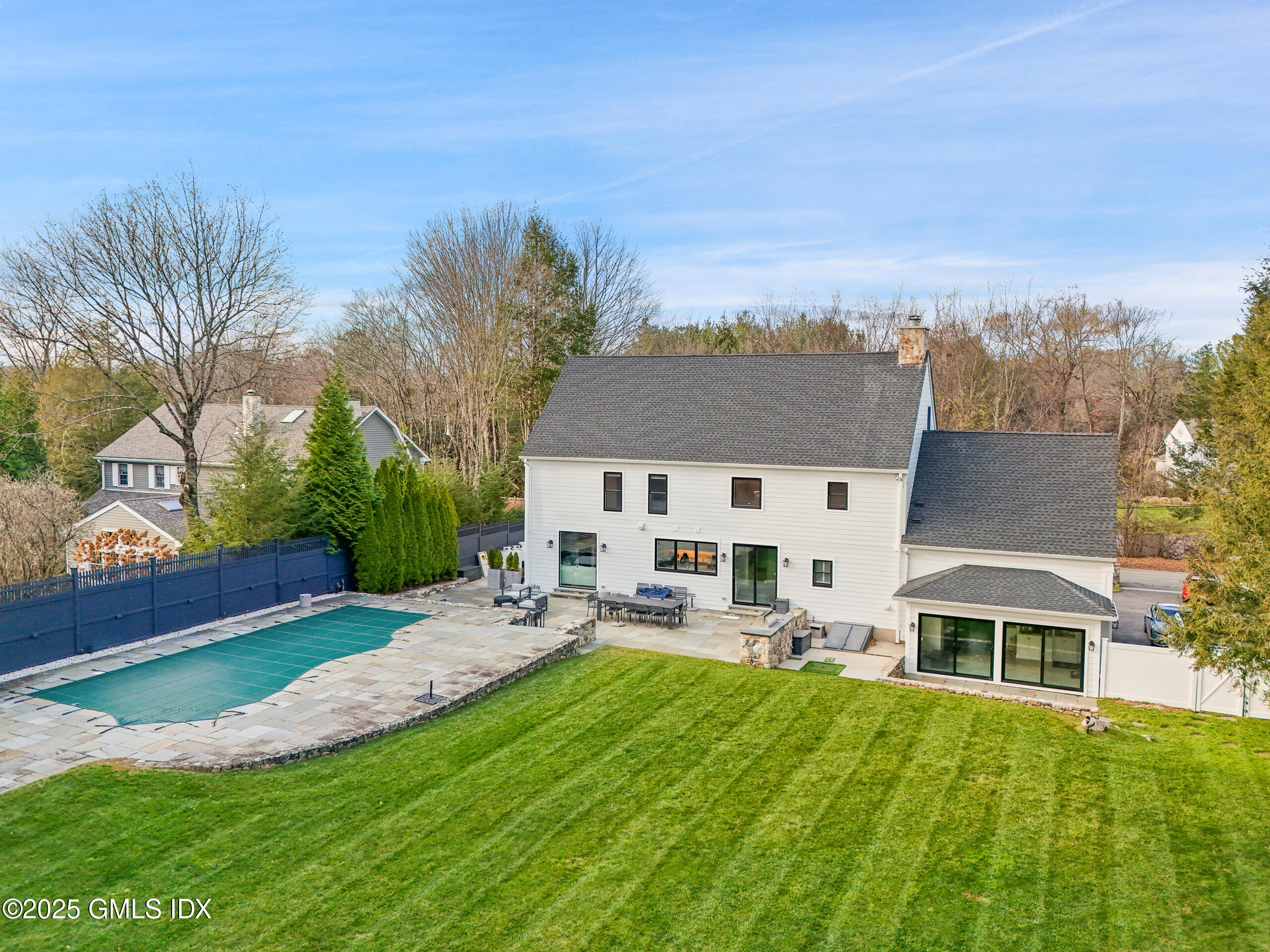4 Banksville Avenue Greenwich, CT 06831 - Photo 32 of 37 a front view of house with yard and green space