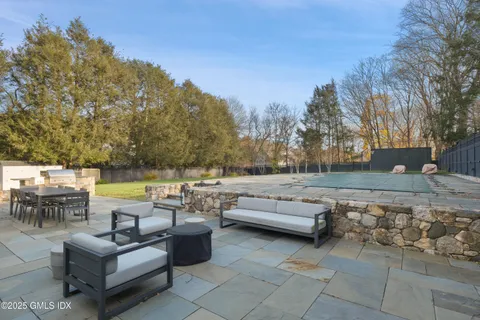 a view of a patio with couches and chairs