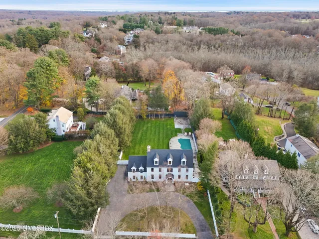 an aerial view of multiple house with outdoor space