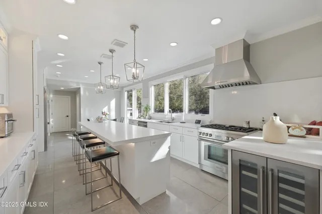 a kitchen with counter space appliances and furniture