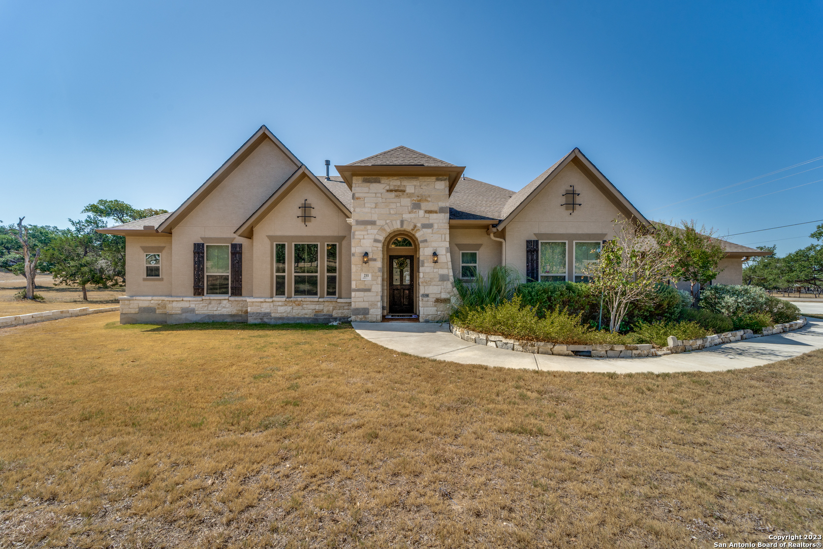 a front view of a house with a yard